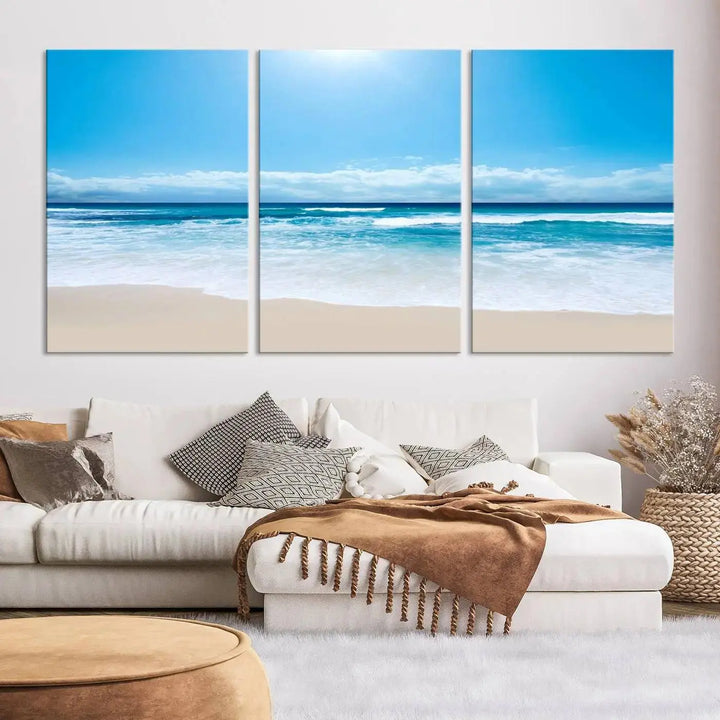 A triptych wall art canvas print titled "Shiny Blue Sea and Beach," crafted on museum-quality canvas, depicts a serene beach scene.