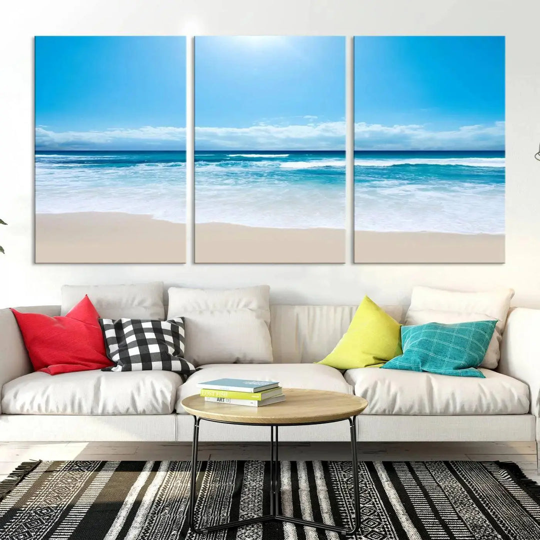 A triptych wall art canvas print titled "Shiny Blue Sea and Beach," crafted on museum-quality canvas, depicts a serene beach scene.