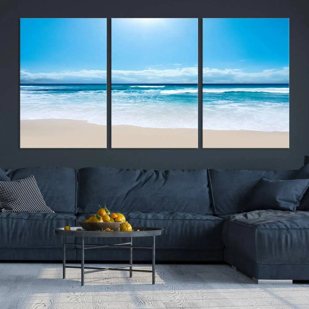 A triptych wall art canvas print titled "Shiny Blue Sea and Beach," crafted on museum-quality canvas, depicts a serene beach scene.