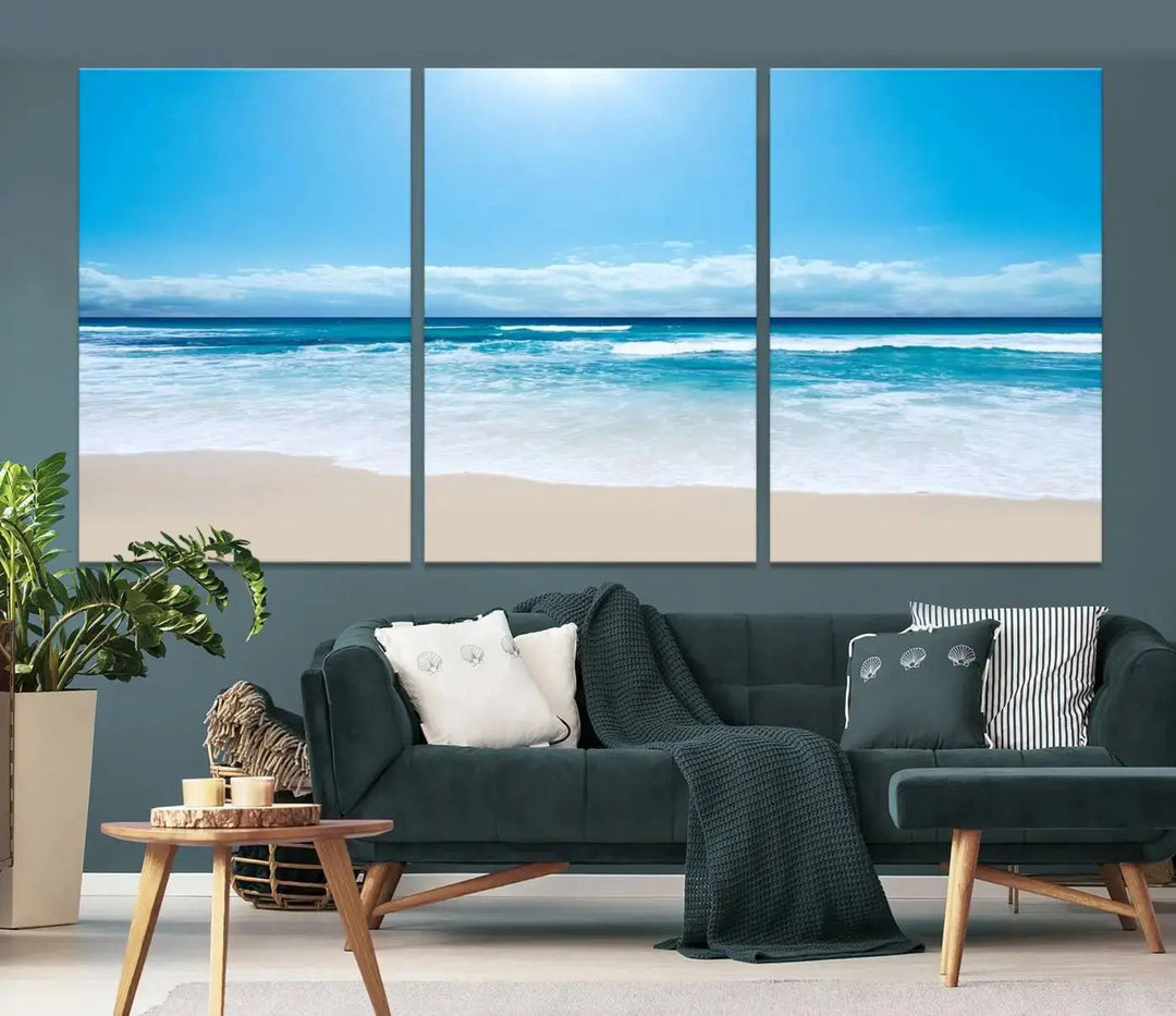 A triptych wall art canvas print titled "Shiny Blue Sea and Beach," crafted on museum-quality canvas, depicts a serene beach scene.