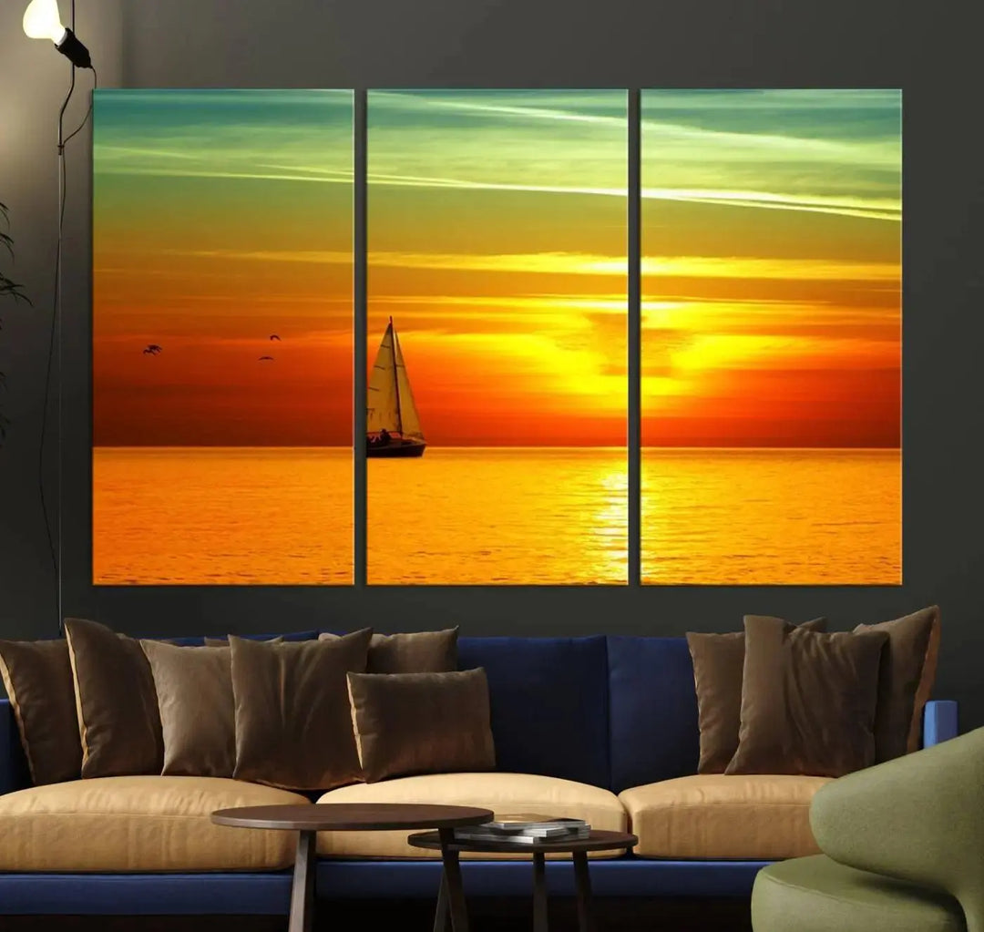 The "Wall Art Canvas Sailboat and Sailors at Sunset" is a triptych showcasing a vibrant sunset over the sea with a sailboat, elegantly displayed on gallery-wrapped, museum-quality canvas. The artworks feature a UV-protective coating to ensure their radiant colors are preserved for years to come.