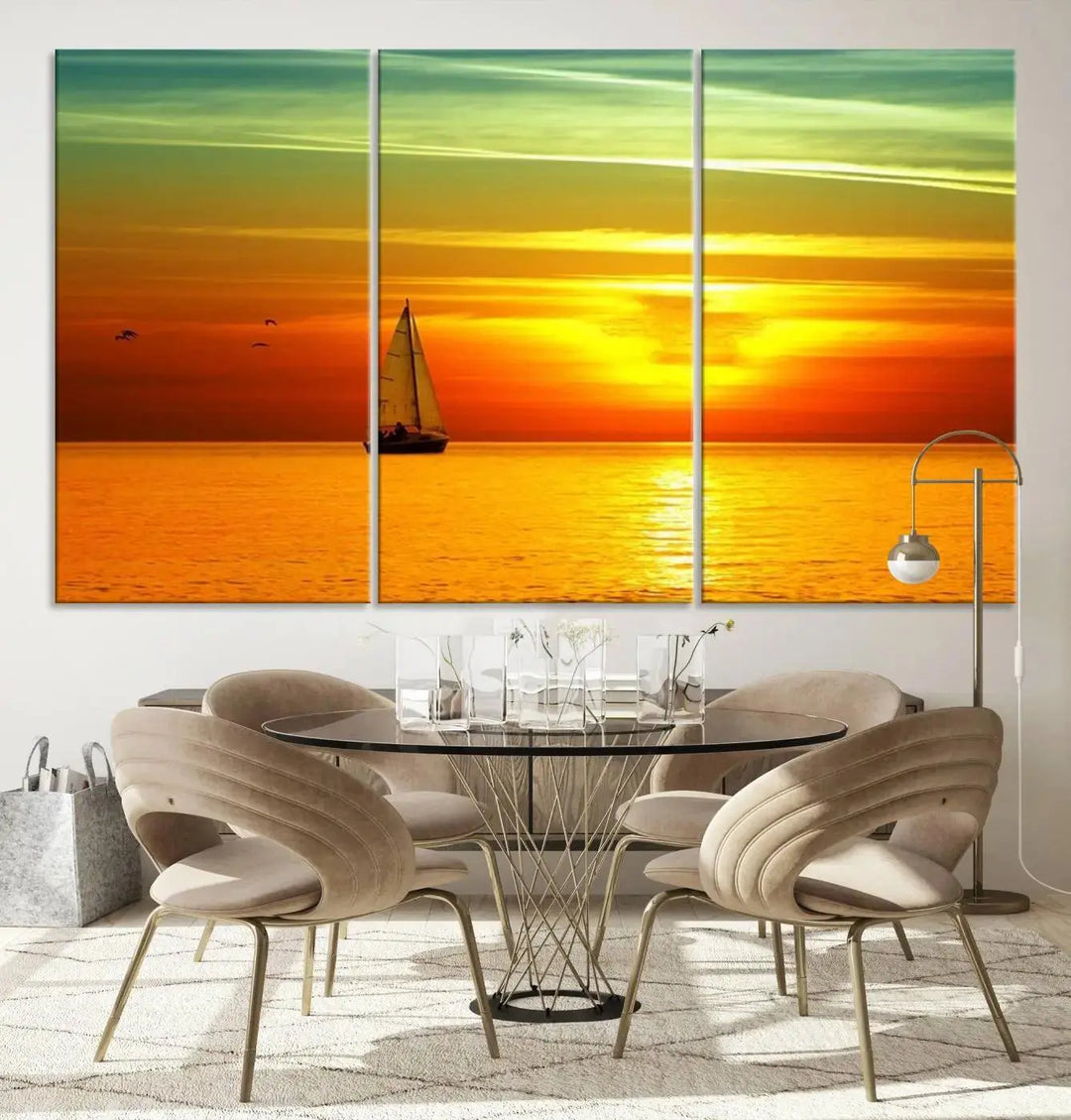 The "Wall Art Canvas Sailboat and Sailors at Sunset" is a triptych showcasing a vibrant sunset over the sea with a sailboat, elegantly displayed on gallery-wrapped, museum-quality canvas. The artworks feature a UV-protective coating to ensure their radiant colors are preserved for years to come.