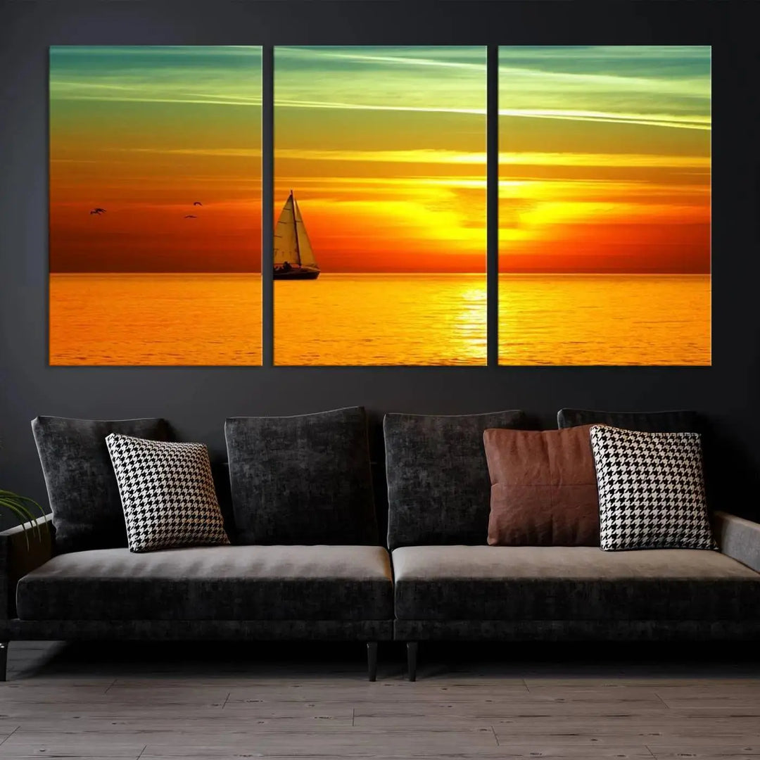 The "Wall Art Canvas Sailboat and Sailors at Sunset" is a triptych showcasing a vibrant sunset over the sea with a sailboat, elegantly displayed on gallery-wrapped, museum-quality canvas. The artworks feature a UV-protective coating to ensure their radiant colors are preserved for years to come.