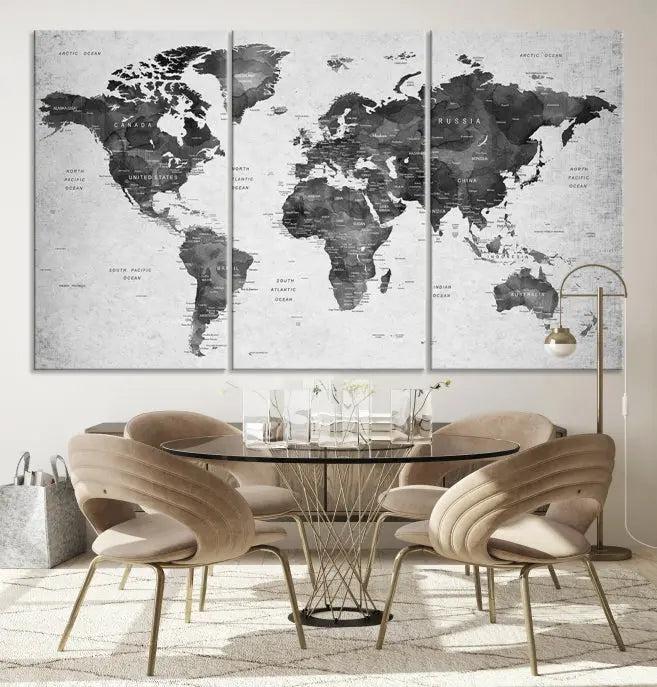 The "Wall Art Gray Black World Map Print" triptych, elegantly gallery wrapped on museum-quality canvas, adorns the wall.