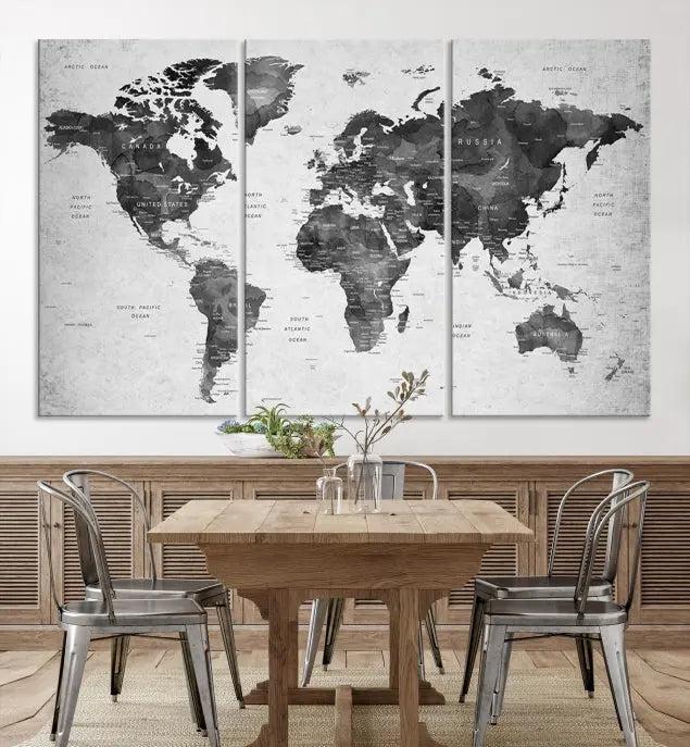 The "Wall Art Gray Black World Map Print" triptych, elegantly gallery wrapped on museum-quality canvas, adorns the wall.