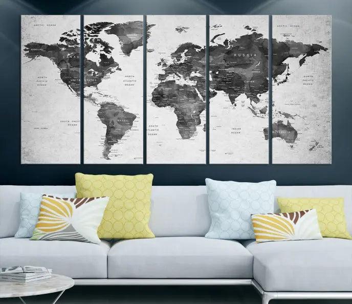 The "Wall Art Gray Black World Map Print" triptych, elegantly gallery wrapped on museum-quality canvas, adorns the wall.