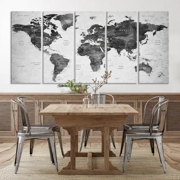 The "Wall Art Gray Black World Map Print" triptych, elegantly gallery wrapped on museum-quality canvas, adorns the wall.