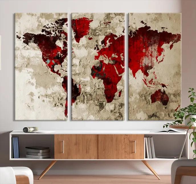 The Wall Art Grunge Red World Map Canvas Print features a three-panel design with red continents on a textured beige background and is elegantly gallery wrapped.