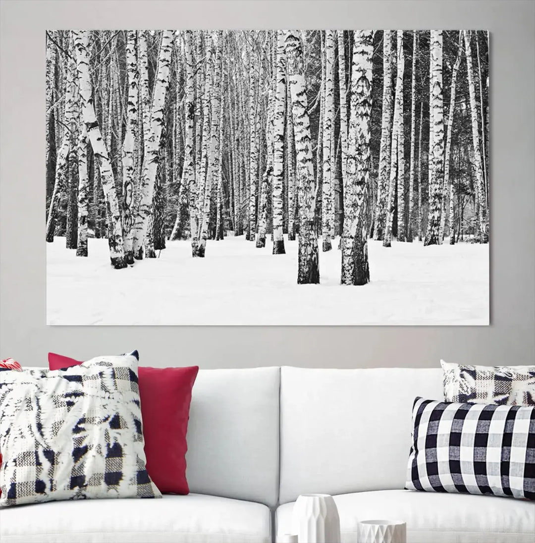 A canvas print titled "Wall Art Landscape Canvas Print Forest in Winter with Snowy Ground and Trees" is displayed, enhancing the modern living room's decor.