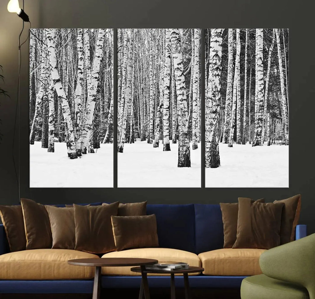 A canvas print titled "Wall Art Landscape Canvas Print Forest in Winter with Snowy Ground and Trees" is displayed, enhancing the modern living room's decor.