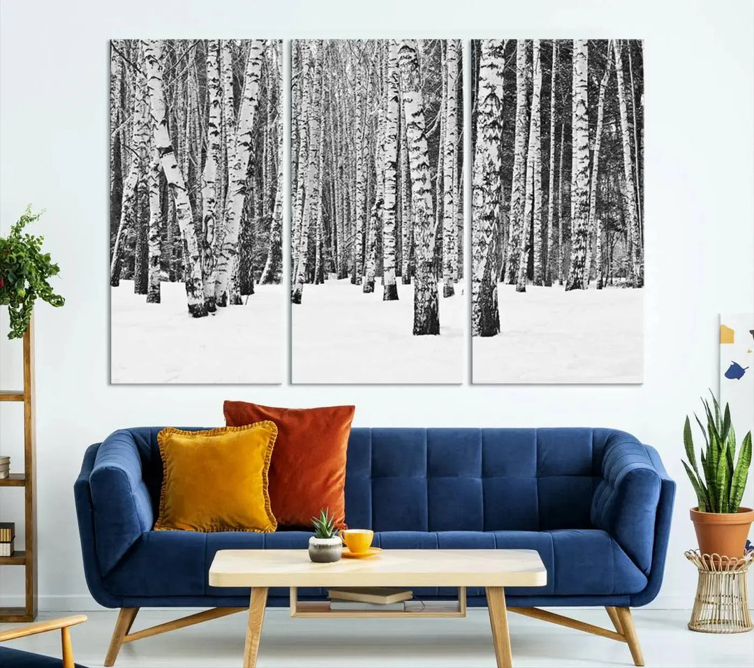 A canvas print titled "Wall Art Landscape Canvas Print Forest in Winter with Snowy Ground and Trees" is displayed, enhancing the modern living room's decor.