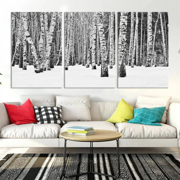 A canvas print titled "Wall Art Landscape Canvas Print Forest in Winter with Snowy Ground and Trees" is displayed, enhancing the modern living room's decor.