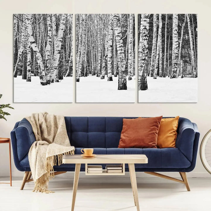 A canvas print titled "Wall Art Landscape Canvas Print Forest in Winter with Snowy Ground and Trees" is displayed, enhancing the modern living room's decor.