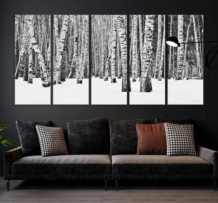 A canvas print titled "Wall Art Landscape Canvas Print Forest in Winter with Snowy Ground and Trees" is displayed, enhancing the modern living room's decor.