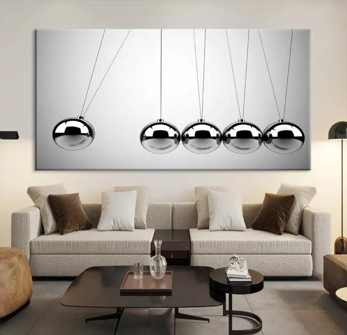 In a contemporary living room, three museum-quality "Wall Art Newton Rules" canvas prints are prominently displayed on the wall.