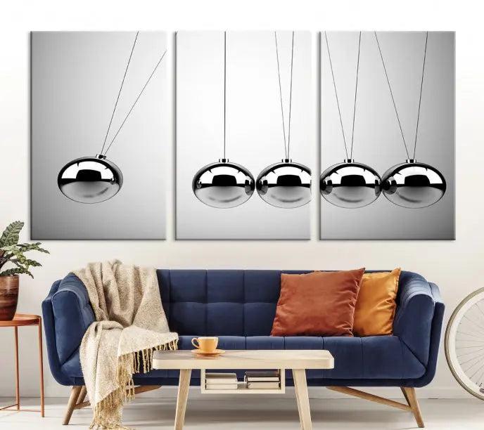 In a contemporary living room, three museum-quality "Wall Art Newton Rules" canvas prints are prominently displayed on the wall.