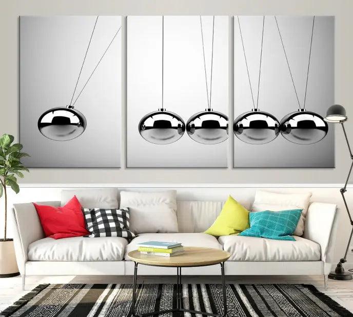 In a contemporary living room, three museum-quality "Wall Art Newton Rules" canvas prints are prominently displayed on the wall.