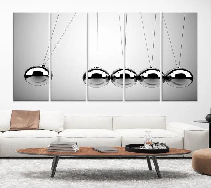 In a contemporary living room, three museum-quality "Wall Art Newton Rules" canvas prints are prominently displayed on the wall.