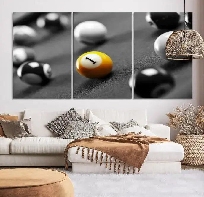 The Wall Art Pool Table and Balls Canvas Print features a triptych design with vibrant billiard balls, highlighting the yellow number 1 ball. This captivating piece is handmade in the USA on museum-quality canvas, offering an exquisite enhancement to your space. It comes with free shipping for your convenience.