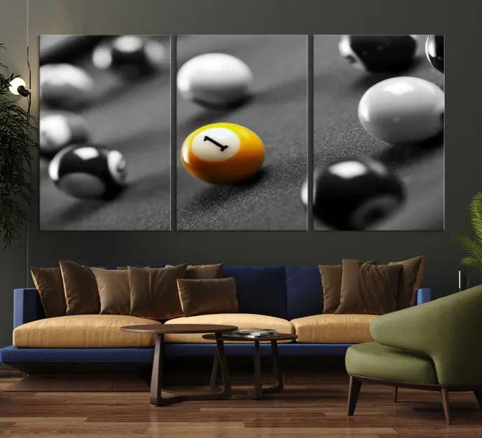 The Wall Art Pool Table and Balls Canvas Print features a triptych design with vibrant billiard balls, highlighting the yellow number 1 ball. This captivating piece is handmade in the USA on museum-quality canvas, offering an exquisite enhancement to your space. It comes with free shipping for your convenience.