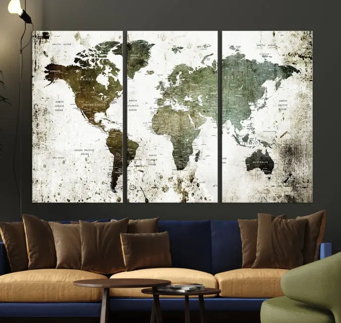 A Wall Art Push Pin World Map Canvas Print is displayed, showcasing an abstract world map in earthy tones. This museum-quality canvas is ready to hang and includes a UV-protective coating to maintain its vibrant shades.