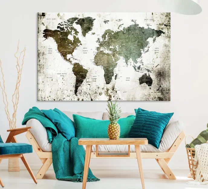 A Wall Art Push Pin World Map Canvas Print is displayed, showcasing an abstract world map in earthy tones. This museum-quality canvas is ready to hang and includes a UV-protective coating to maintain its vibrant shades.