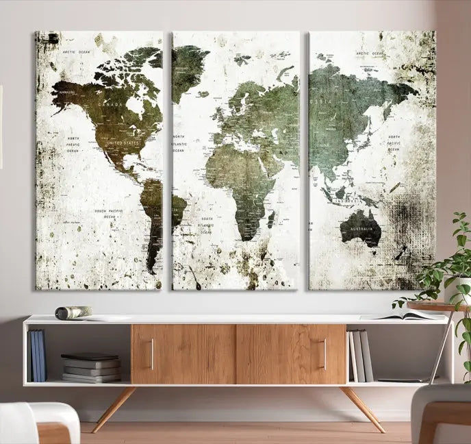 A Wall Art Push Pin World Map Canvas Print is displayed, showcasing an abstract world map in earthy tones. This museum-quality canvas is ready to hang and includes a UV-protective coating to maintain its vibrant shades.