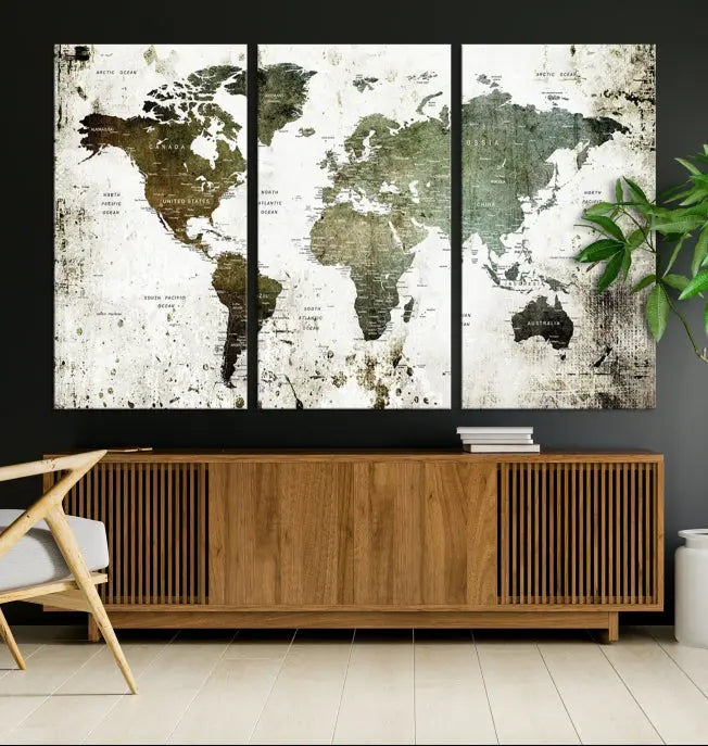 A Wall Art Push Pin World Map Canvas Print is displayed, showcasing an abstract world map in earthy tones. This museum-quality canvas is ready to hang and includes a UV-protective coating to maintain its vibrant shades.