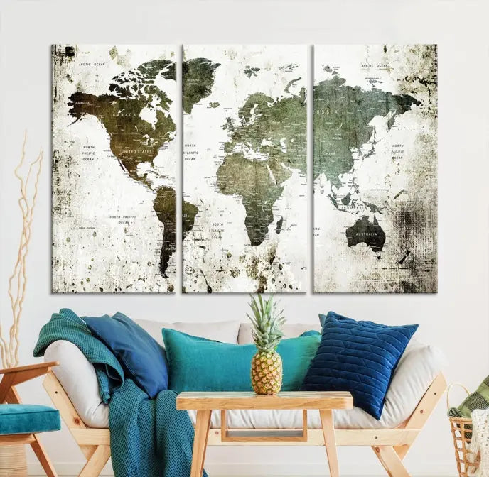 A Wall Art Push Pin World Map Canvas Print is displayed, showcasing an abstract world map in earthy tones. This museum-quality canvas is ready to hang and includes a UV-protective coating to maintain its vibrant shades.