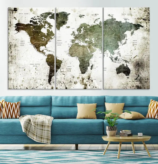 A Wall Art Push Pin World Map Canvas Print is displayed, showcasing an abstract world map in earthy tones. This museum-quality canvas is ready to hang and includes a UV-protective coating to maintain its vibrant shades.