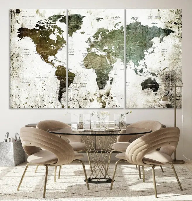 A Wall Art Push Pin World Map Canvas Print is displayed, showcasing an abstract world map in earthy tones. This museum-quality canvas is ready to hang and includes a UV-protective coating to maintain its vibrant shades.