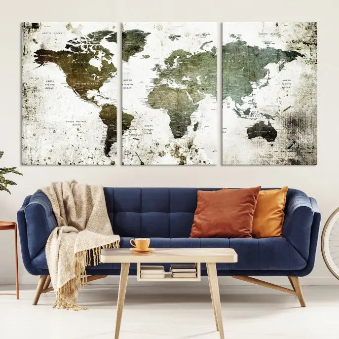 A Wall Art Push Pin World Map Canvas Print is displayed, showcasing an abstract world map in earthy tones. This museum-quality canvas is ready to hang and includes a UV-protective coating to maintain its vibrant shades.