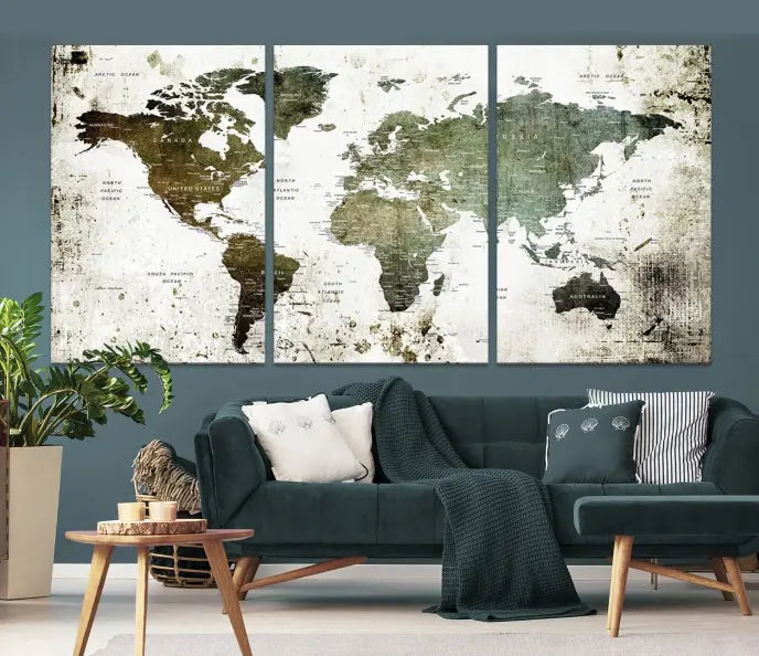 A Wall Art Push Pin World Map Canvas Print is displayed, showcasing an abstract world map in earthy tones. This museum-quality canvas is ready to hang and includes a UV-protective coating to maintain its vibrant shades.