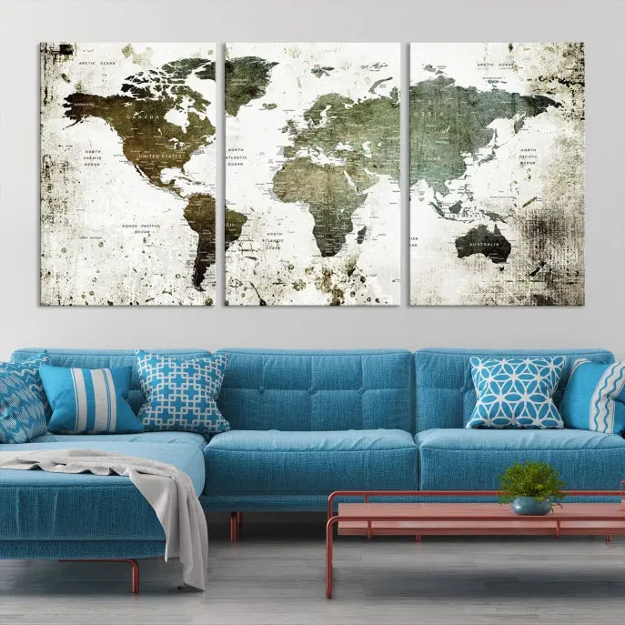 A Wall Art Push Pin World Map Canvas Print is displayed, showcasing an abstract world map in earthy tones. This museum-quality canvas is ready to hang and includes a UV-protective coating to maintain its vibrant shades.