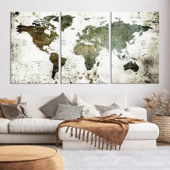 A Wall Art Push Pin World Map Canvas Print is displayed, showcasing an abstract world map in earthy tones. This museum-quality canvas is ready to hang and includes a UV-protective coating to maintain its vibrant shades.