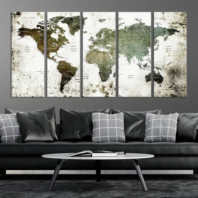 A Wall Art Push Pin World Map Canvas Print is displayed, showcasing an abstract world map in earthy tones. This museum-quality canvas is ready to hang and includes a UV-protective coating to maintain its vibrant shades.