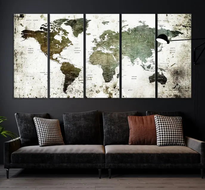 A Wall Art Push Pin World Map Canvas Print is displayed, showcasing an abstract world map in earthy tones. This museum-quality canvas is ready to hang and includes a UV-protective coating to maintain its vibrant shades.