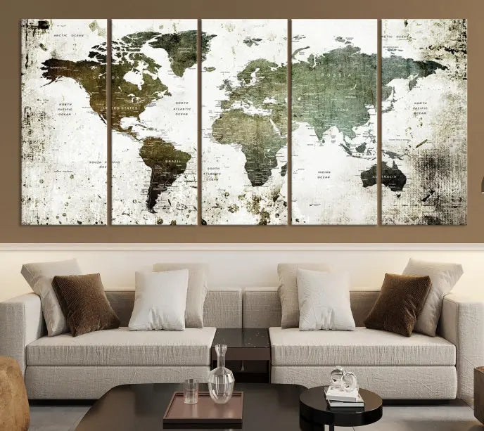 A Wall Art Push Pin World Map Canvas Print is displayed, showcasing an abstract world map in earthy tones. This museum-quality canvas is ready to hang and includes a UV-protective coating to maintain its vibrant shades.