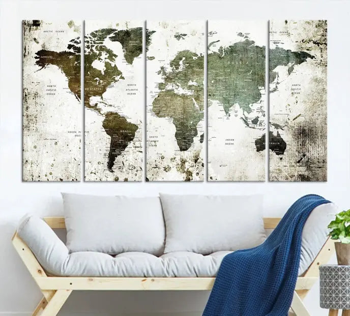 A Wall Art Push Pin World Map Canvas Print is displayed, showcasing an abstract world map in earthy tones. This museum-quality canvas is ready to hang and includes a UV-protective coating to maintain its vibrant shades.