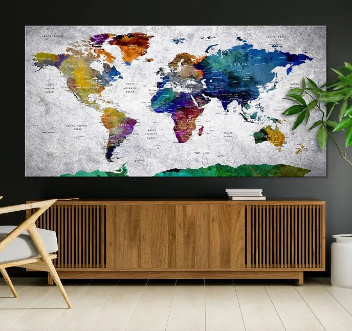 A three-panel, museum-quality Wall Art Push Pin World Map with Antarctica Canvas Print elegantly hangs, adding sophistication to the space.