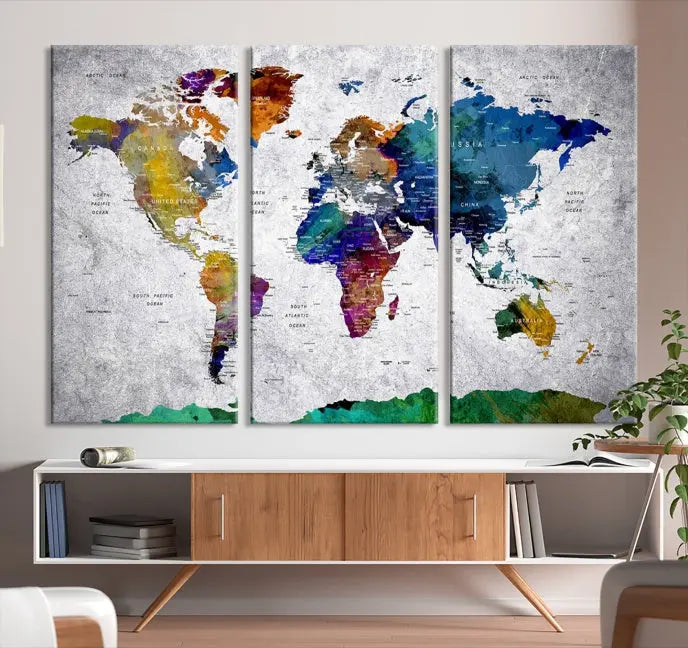 A three-panel, museum-quality Wall Art Push Pin World Map with Antarctica Canvas Print elegantly hangs, adding sophistication to the space.