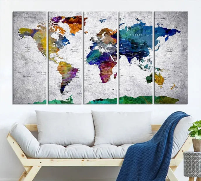 A three-panel, museum-quality Wall Art Push Pin World Map with Antarctica Canvas Print elegantly hangs, adding sophistication to the space.