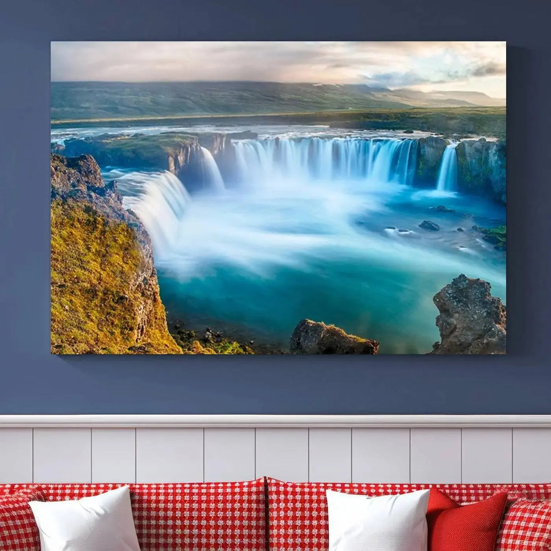 A large triptych of the "Wall Art Waterfall Canvas Print Grand Waterfall on a Plain" adorns the living room wall, crafted on museum-quality canvas. This artwork—handmade in the USA—comes with free shipping for those wishing to elevate their space.