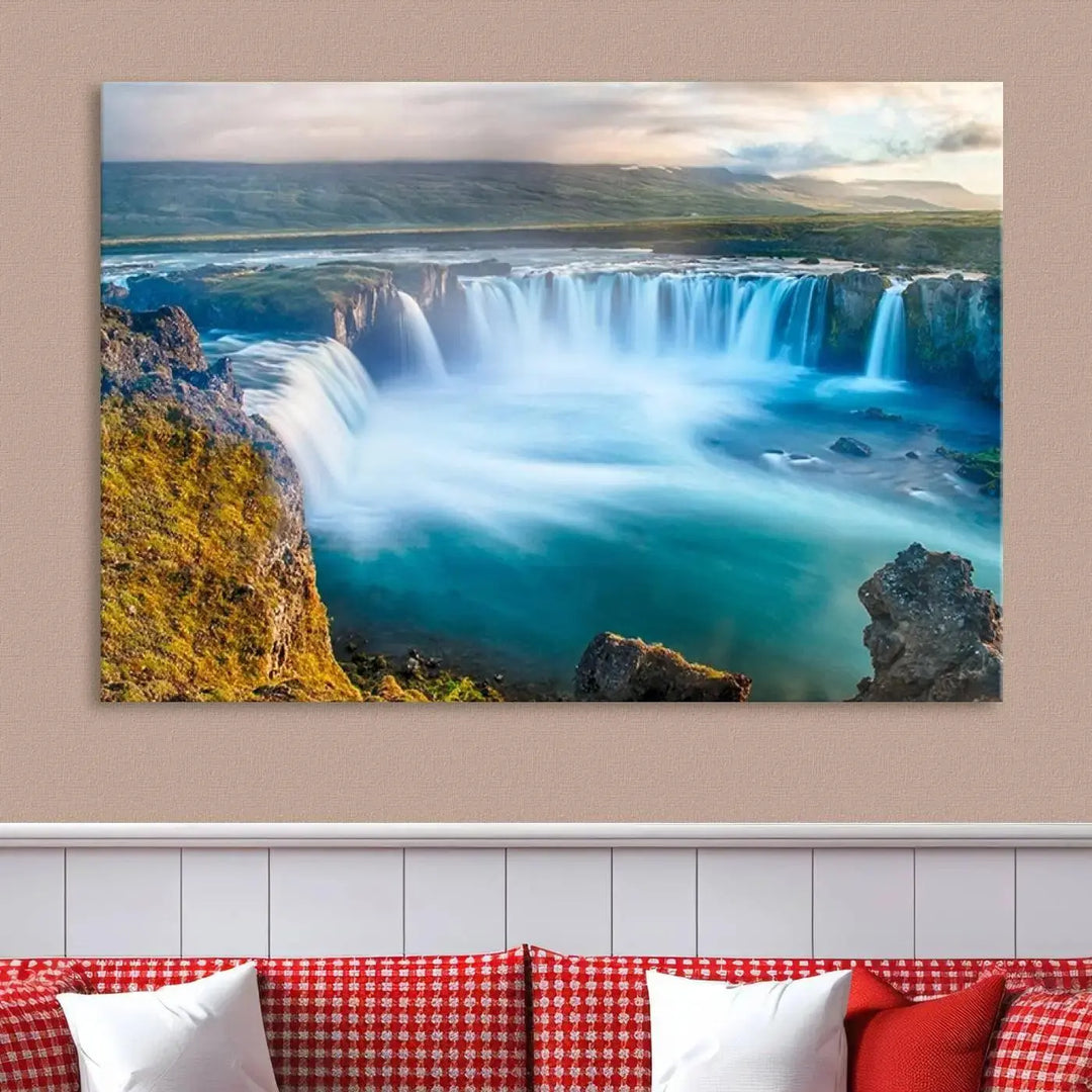 A large triptych of the "Wall Art Waterfall Canvas Print Grand Waterfall on a Plain" adorns the living room wall, crafted on museum-quality canvas. This artwork—handmade in the USA—comes with free shipping for those wishing to elevate their space.