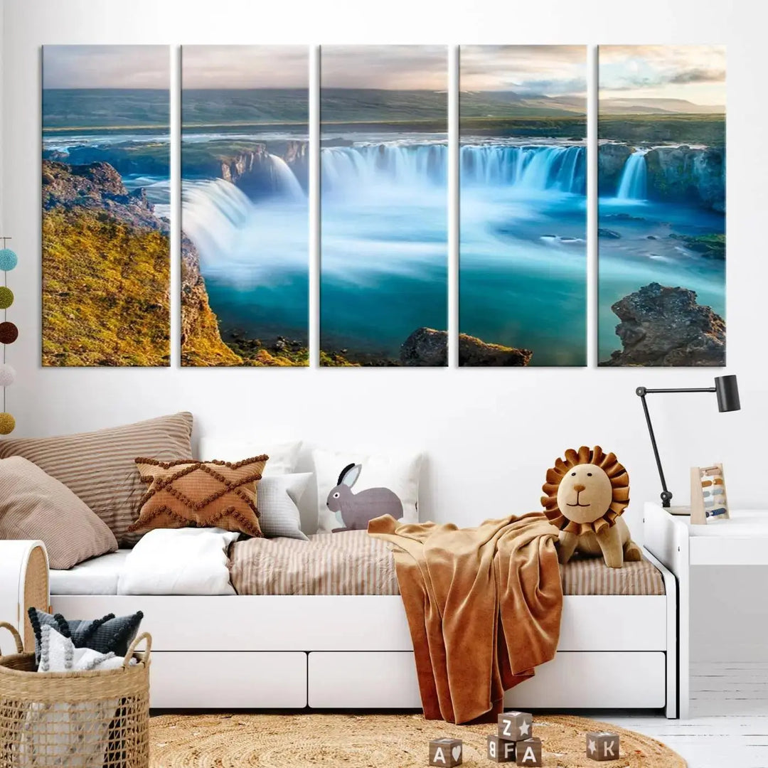 A large triptych of the "Wall Art Waterfall Canvas Print Grand Waterfall on a Plain" adorns the living room wall, crafted on museum-quality canvas. This artwork—handmade in the USA—comes with free shipping for those wishing to elevate their space.