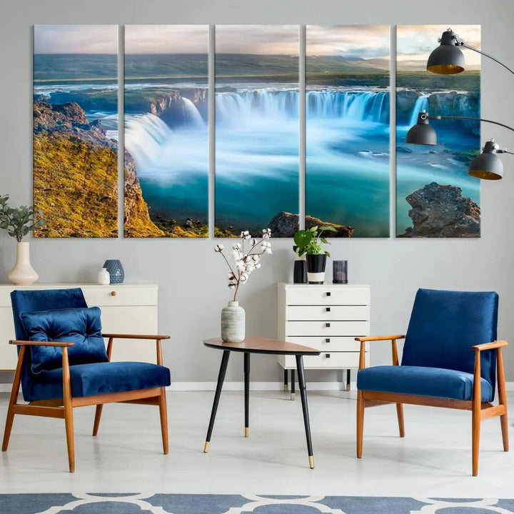 A large triptych of the "Wall Art Waterfall Canvas Print Grand Waterfall on a Plain" adorns the living room wall, crafted on museum-quality canvas. This artwork—handmade in the USA—comes with free shipping for those wishing to elevate their space.