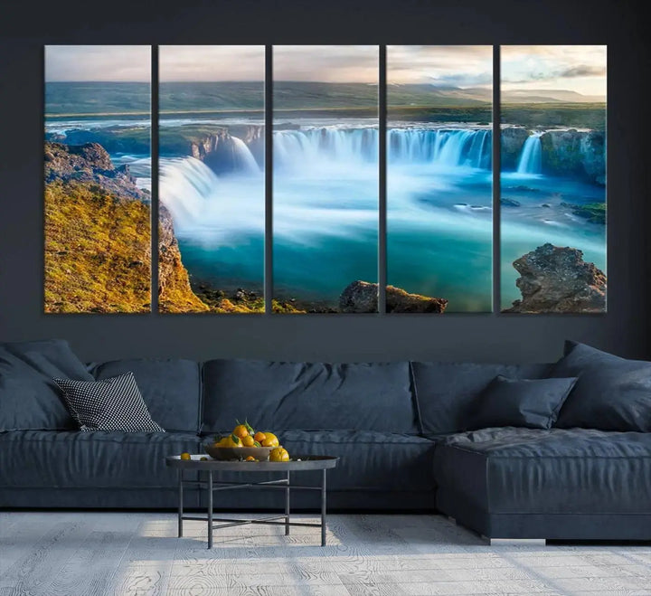 A large triptych of the "Wall Art Waterfall Canvas Print Grand Waterfall on a Plain" adorns the living room wall, crafted on museum-quality canvas. This artwork—handmade in the USA—comes with free shipping for those wishing to elevate their space.