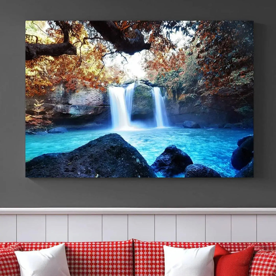 In the living room, a hand-assembled triptych titled "Wall Art Waterfall Canvas Print Great Double Waterfalls with Bright Water in Forest" is displayed on museum-quality canvas.