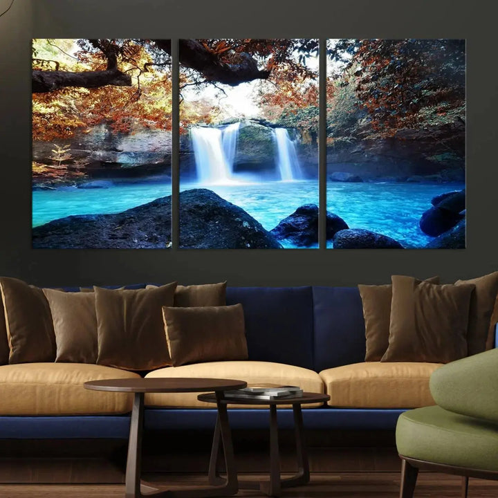 In the living room, a hand-assembled triptych titled "Wall Art Waterfall Canvas Print Great Double Waterfalls with Bright Water in Forest" is displayed on museum-quality canvas.