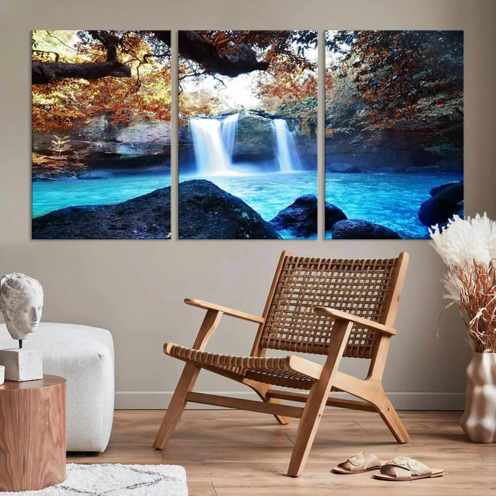 In the living room, a hand-assembled triptych titled "Wall Art Waterfall Canvas Print Great Double Waterfalls with Bright Water in Forest" is displayed on museum-quality canvas.